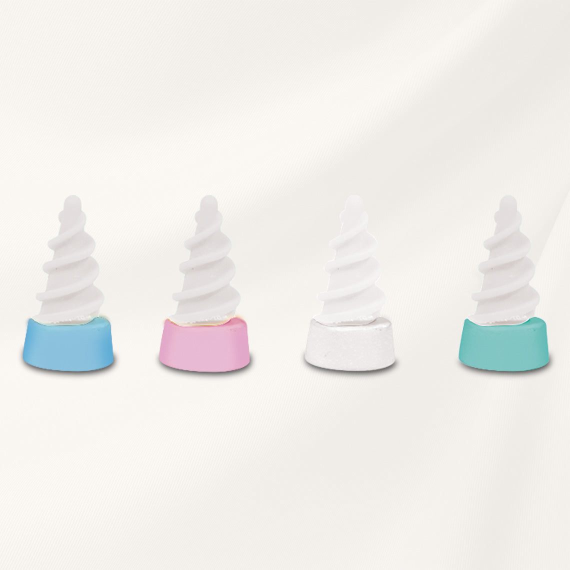 Ear Wizard Ersatzaufsätze in vier Farben – weiche, spiralförmige Spitzen für hygienische Mehrfachverwendung.